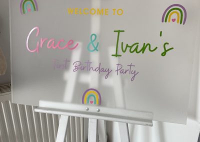 Rainbow first birthday sign